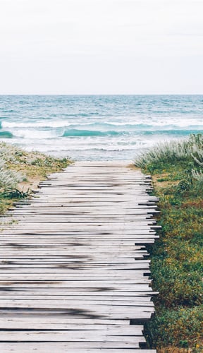 Wooden boardwalk leading to the ocean